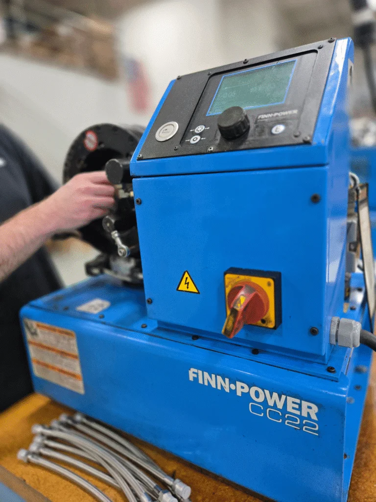Finn-Power CC22 hose crimping machine on the Crossroads production floor