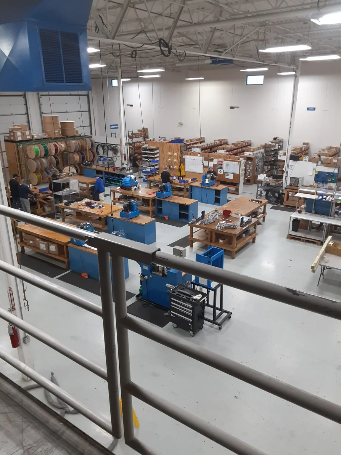 Overhead view of the Crossroads Manufacturing production floor with hose and fitting work cells